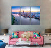 Skyscrapers along River Canvas Print